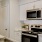 a kitchen with white cabinets