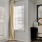 a room with a desk and a mirror