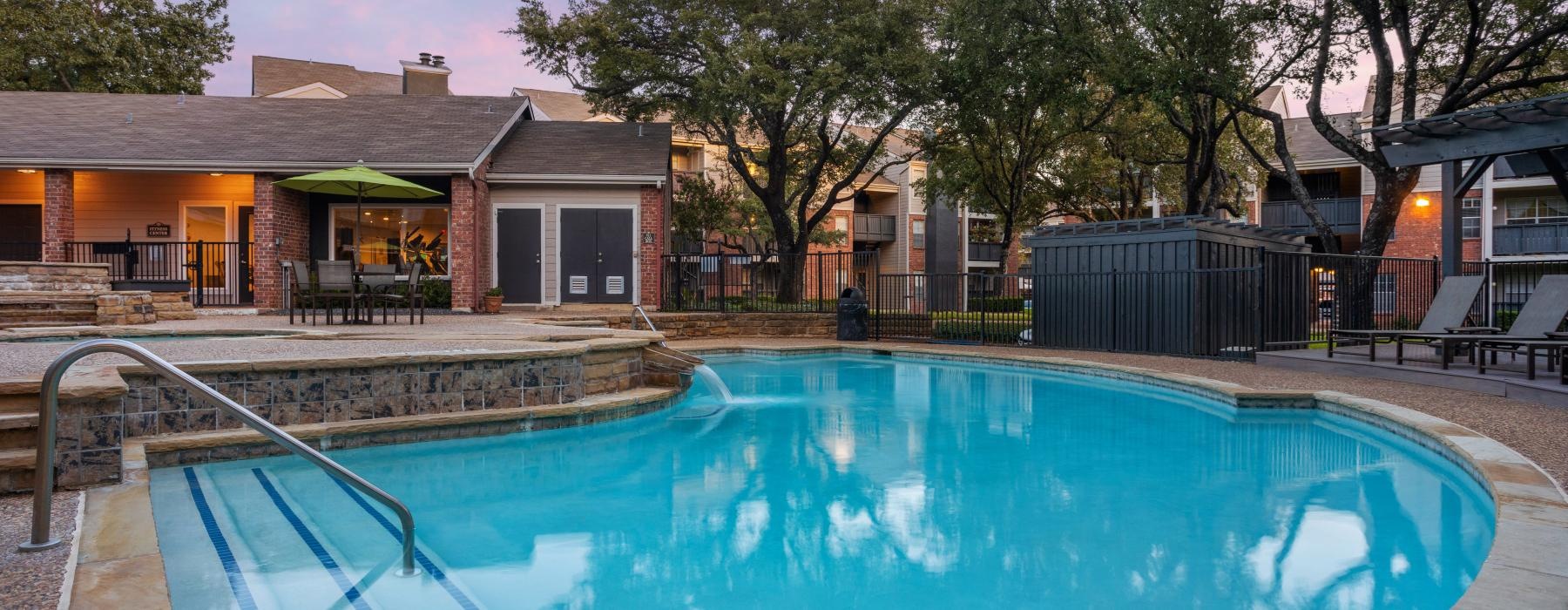 a swimming pool at dusk