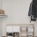 a large closet with clothes hanging and additional storage set up