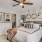 a bedroom with a bed and a fan