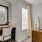 a room with a desk and a mirror