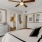 a bedroom with a fan and bed