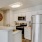 a kitchen with white cabinets