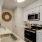 a kitchen with white cabinets
